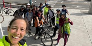 Bicyclists standing in group near bikes